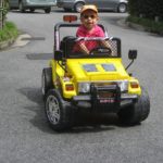 Little boy in his first car driving