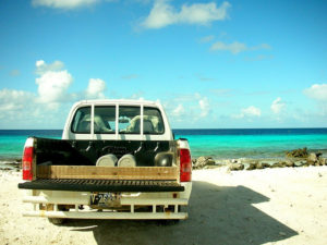 Car at the beach, rear view