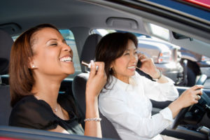Two women on the road distracted while driving 
