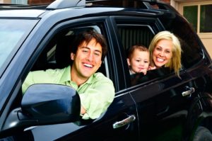 Happy family in car