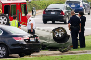 Car lying on top after accident. 