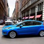 Blue Ford Fiesta in city center